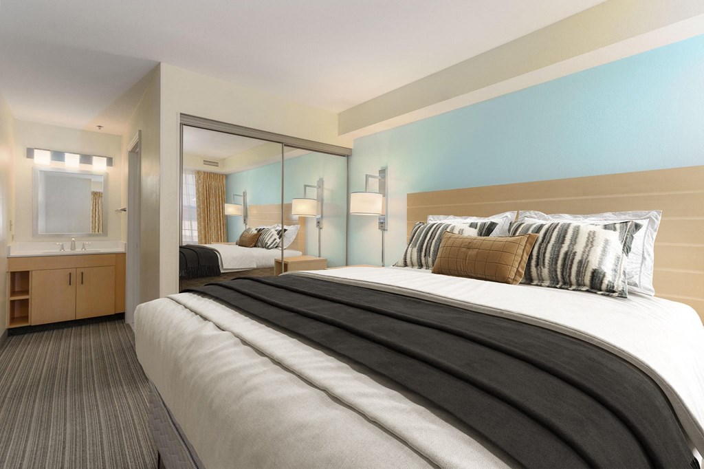 a hotel room with a bed and a bathroom